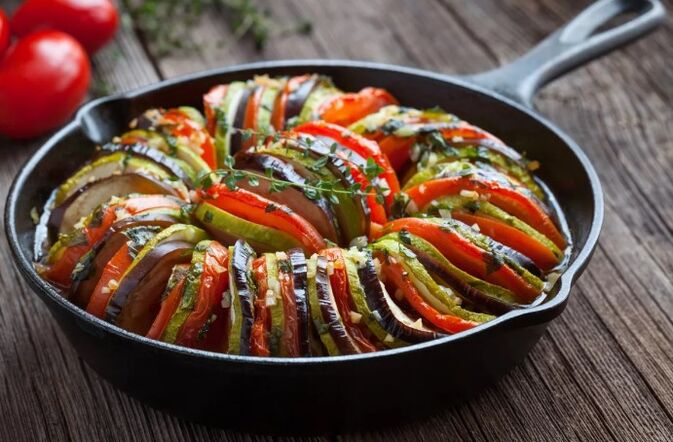 Garnish with tomato and zucchini